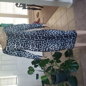 Buttery soft body hugging zippered piping long sleeve snow leopard midi